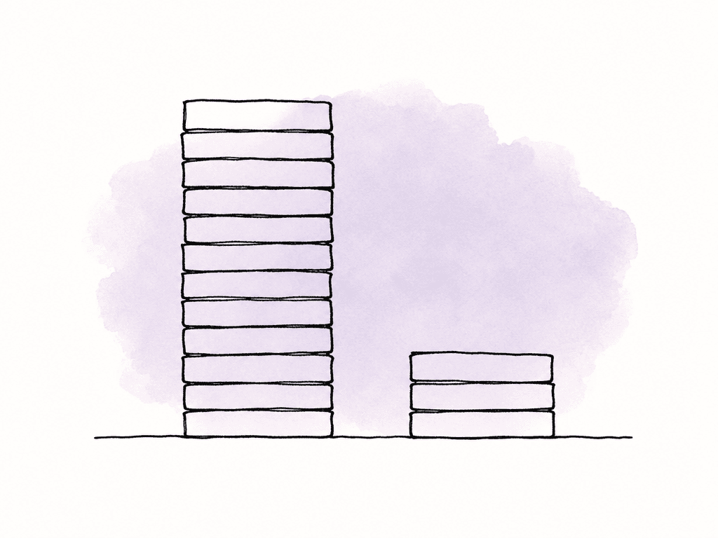 A tall stack of media drives beside a much smaller stack, suggesting different storage demands.