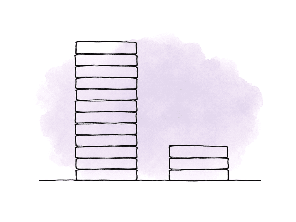A tall stack of media drives beside a much smaller stack, suggesting different storage demands.